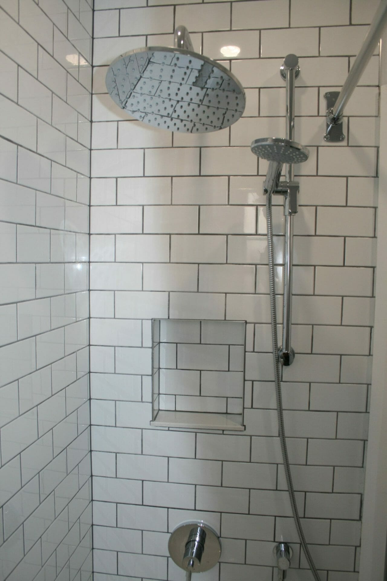 Subway tiles with shower niche by High Park Handyman